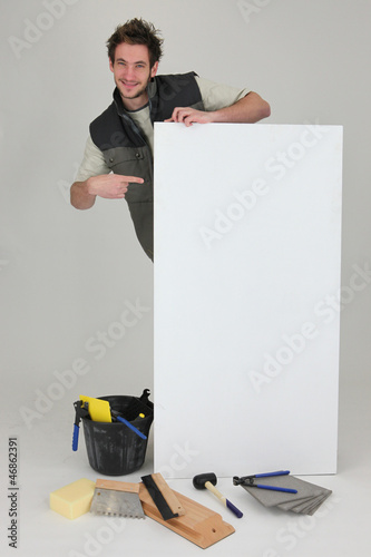 Photo: Tiler pointing advertising panel Tiler pointing advertising panel