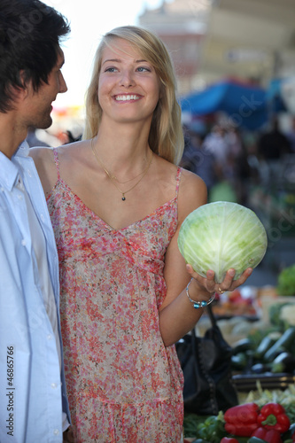 Photo: Couple buying vegetables Couple buying vegetables
