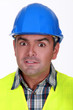 Portrait of horrified builder