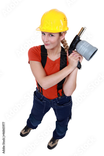 Photo: Tradeswoman holding a blowtorch Tradeswoman holding a blowtorch