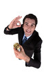 Businessman drinking a glass and giving the a-ok gesture