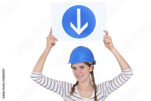 Photo: Woman holding a road sign Woman holding a road sign