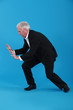 Businessman pushing against empty copyspace
