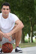 Man crouching on basketball