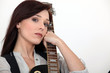 Woman holding an electric guitar