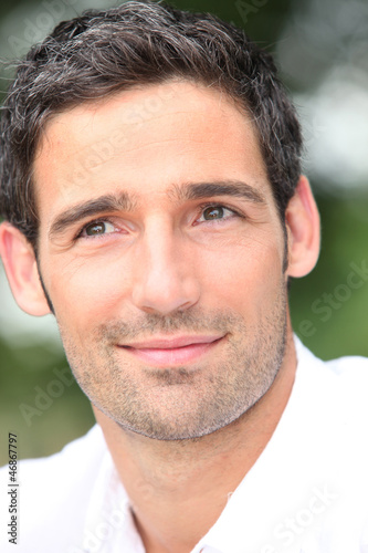 Photo: Close-up of dark haired man Close-up of dark haired man
