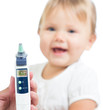 Thermometer displaying 36,6 Celsius degrees on defocused happy k