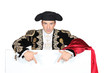 Torero pointing white panel