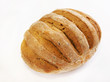 Photo: Rye loaf over light background Rye loaf over light background