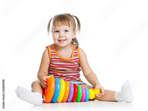 Photo: little girl kid playing with toy little girl kid playing with toy