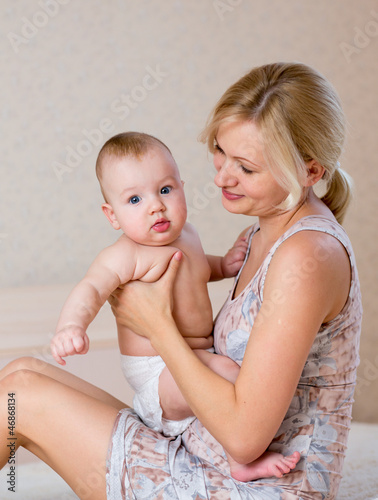 Photo: mother holding baby boy mother holding baby boy