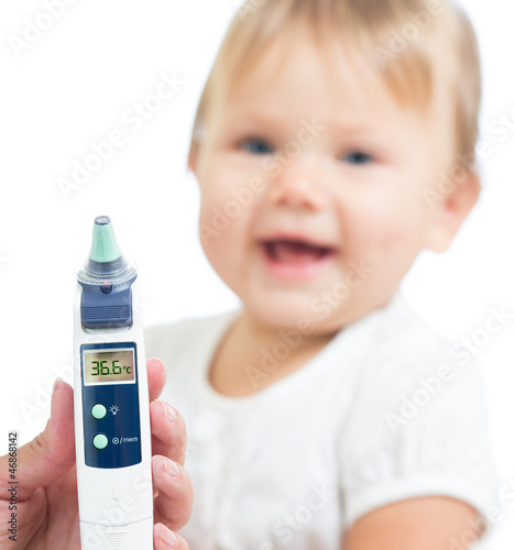 Photo: Thermometer displaying 36,6 Celsius degrees on defocused happy k Thermometer displaying 36,6 Celsius degrees on defocused happy k