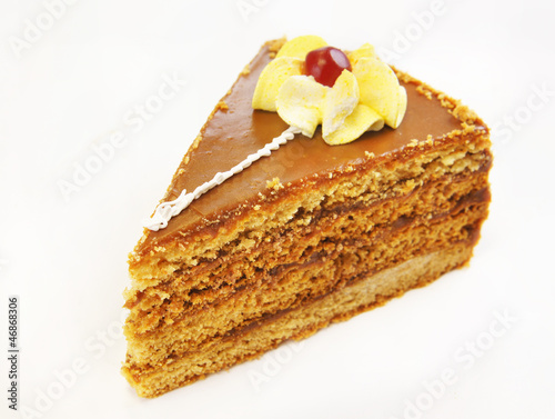 Photo: Triangular cake with decorative flower Triangular cake with decorative flower