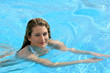 Young woman swimming in a pool