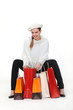 Woman sat down with her shopping bags