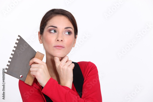 Photo: Female plasterer thinking Female plasterer thinking
