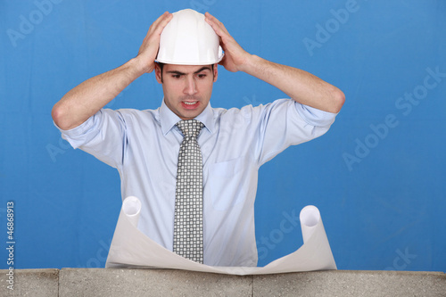 Photo: An architect having a hard time. An architect having a hard time.