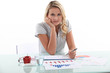 Woman sitting at her desk with statistics