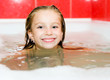 Little girl is taking a bath