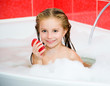 girl in the bath with a soap
