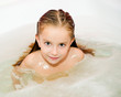 Little girl is taking a bath