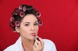 Woman beautifying herself