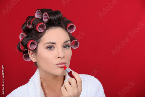 Photo: Woman beautifying herself Woman beautifying herself