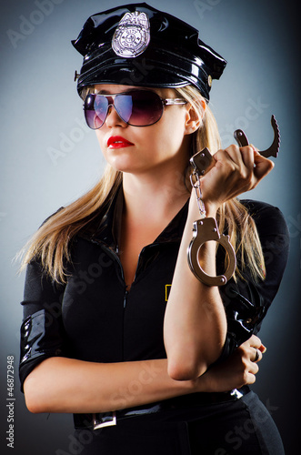 Photo: Attractive police office in dark room Attractive police office in dark room