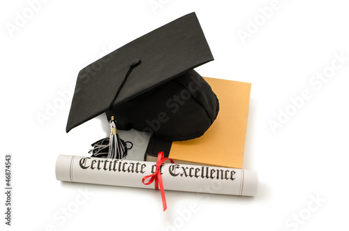 Photo: Grad hat and diploma with book isolated on white Grad hat and diploma with book isolated on white