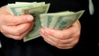 Accountant counts the money.