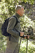 A mature man walking outdoors