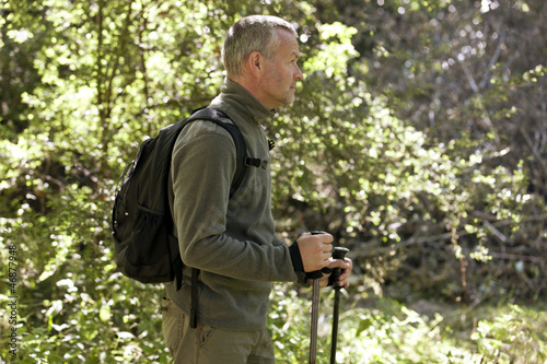 Photo: A mature man walking outdoors A mature man walking outdoors