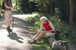 A mature couple resting beside a country path