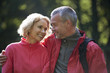 A mature couple outdoors, looking affectionately at each other