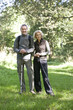 A mature couple standing in the countryside together