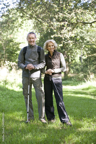 Photo: A mature couple standing in the countryside together A mature couple standing in the countryside together