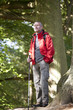 A mature man standing in the countryside