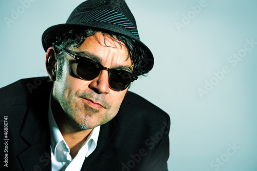 Photo: man with hat and sunglasses man with hat and sunglasses