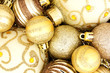 Christmas background of varied gold baubles
