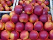 Nectarines in a box at the greengrocer
