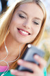 Young woman with music player