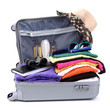 Open silver suitcase with clothing isolated on white