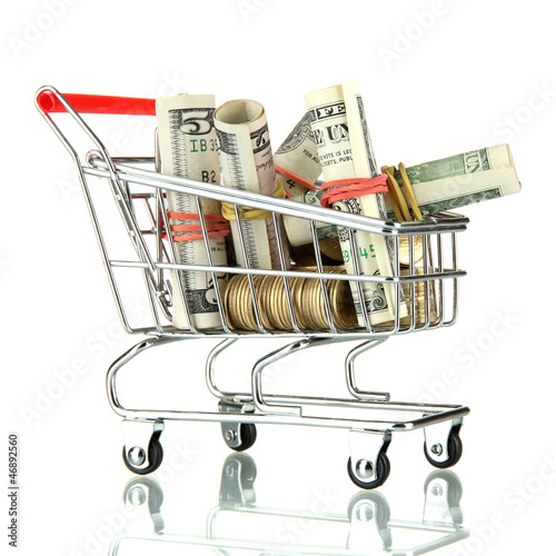 Photo: shopping trolley with dollars and Ukrainian coins, isolated shopping trolley with dollars and Ukrainian coins, isolated