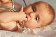 Foto: Baby playing with a stethoscope Baby playing with a stethoscope