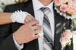Hands of the groom and the bride with wedding rings