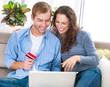 Online Shopping. Couple Using Credit Card to Internet Shop