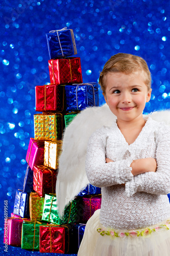 Photo: Christmas, Angel - lovely little girl with Christmas gifts Christmas, Angel - lovely little girl with Christmas gifts