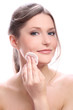 Foto: Attractive and happy woman cleaning her face Attractive and happy woman cleaning her face