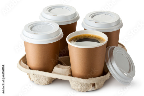 Photo: Four take-out coffee in holder. One cup is openend. Four take-out coffee in holder. One cup is openend.