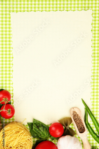 Photo: paper for recipes,vegetables and spices on green background paper for recipes,vegetables and spices on green background
